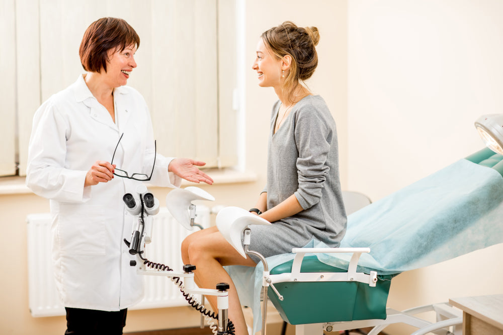 Young woman patient with a senior gynecologist during the consultation in the gynecological office
